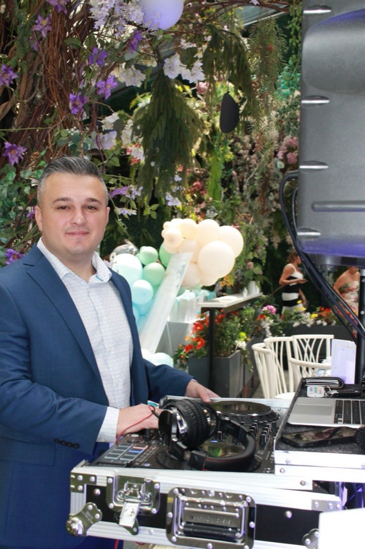 DJ Joe of Bello Entertainment at the booth during a baby shower at Angelina's Ristorante in Tottenville, Staten Island