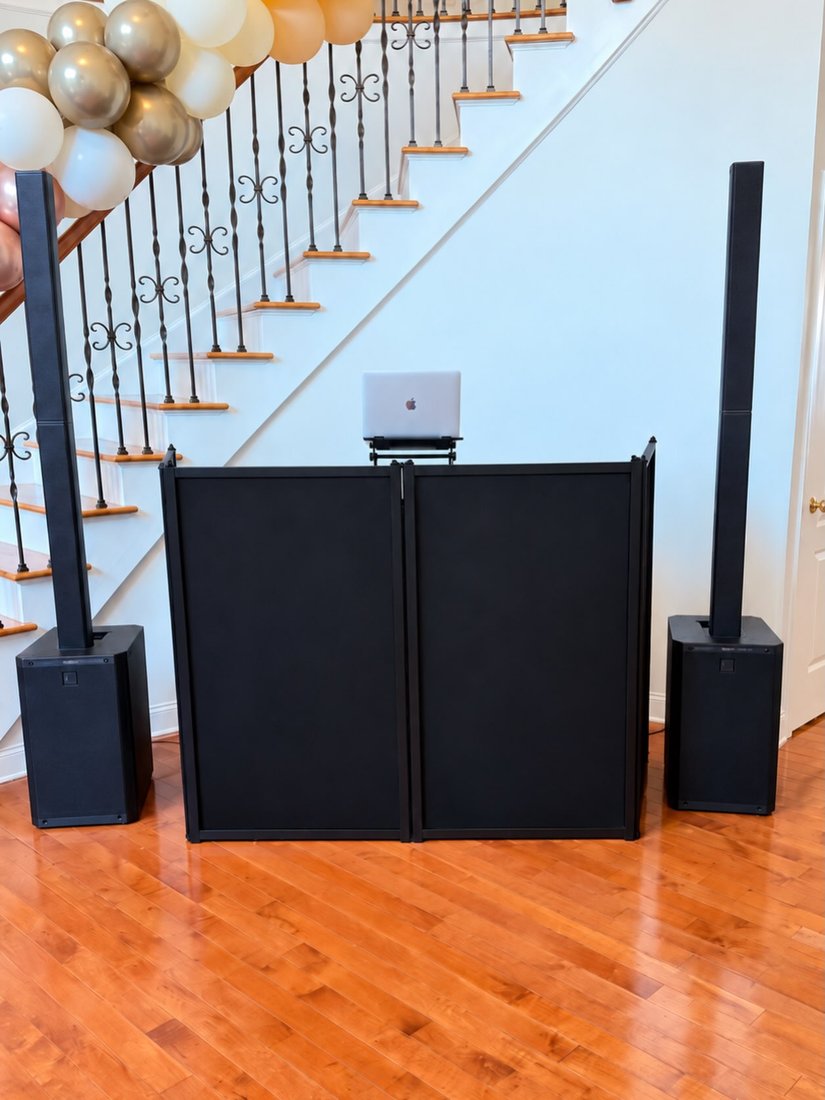 Bello Entertainment DJ booth and tower speakers set up under the staircase in the foyer of a New Jersey home for a housewarming party